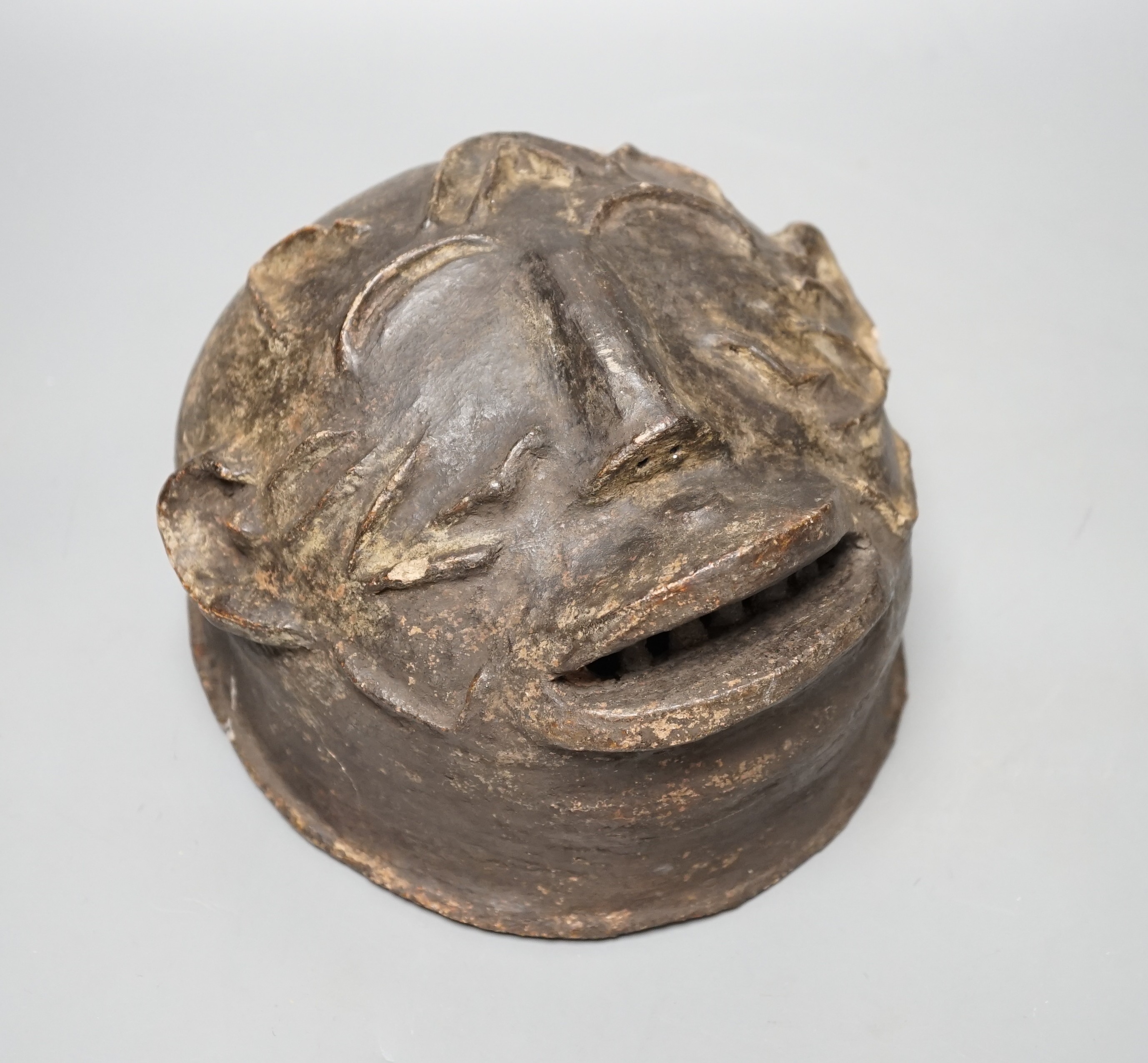 A terracotta Makonde helmet mask (Tanzanian) 21cm diameter